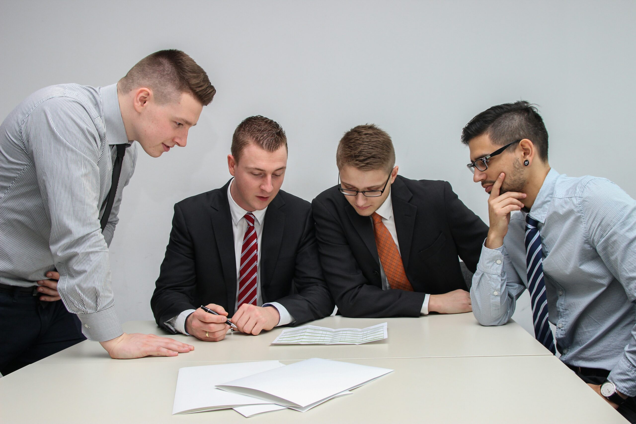 Company directors reviewing corporate governance and compliance documents
