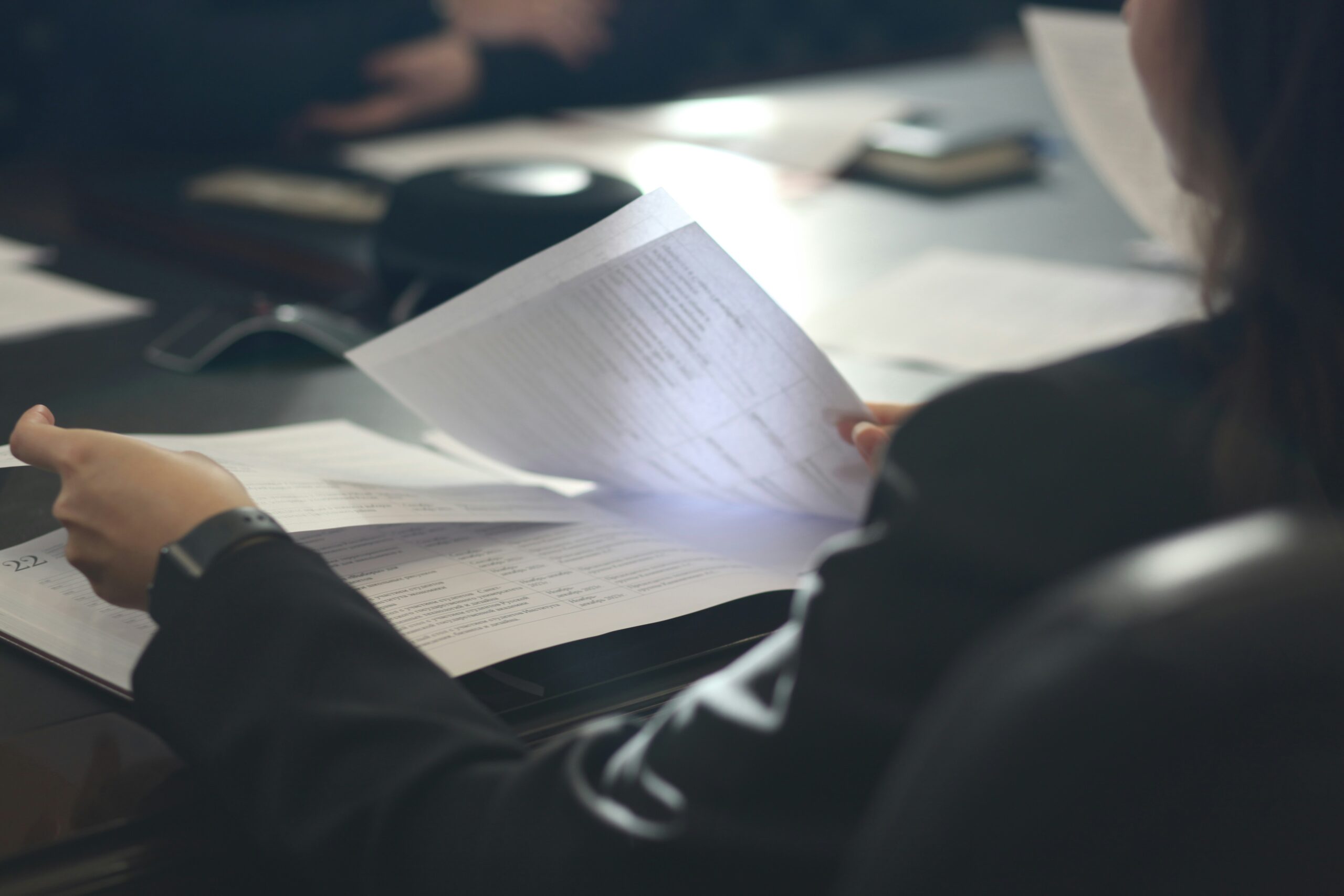 Professional consultant reviewing documents and written advice
